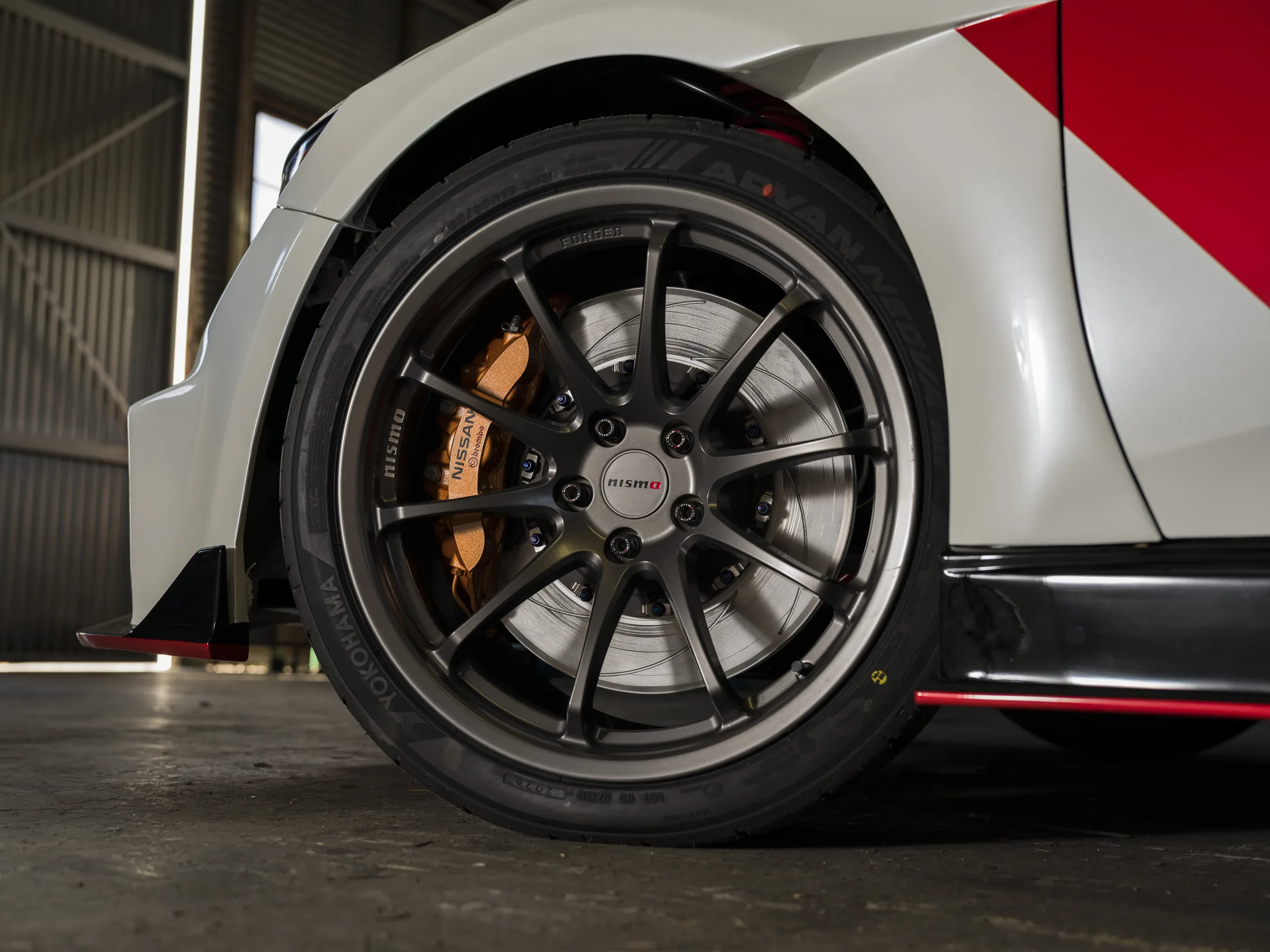 forged wheel and brake assembly on the Sentra.